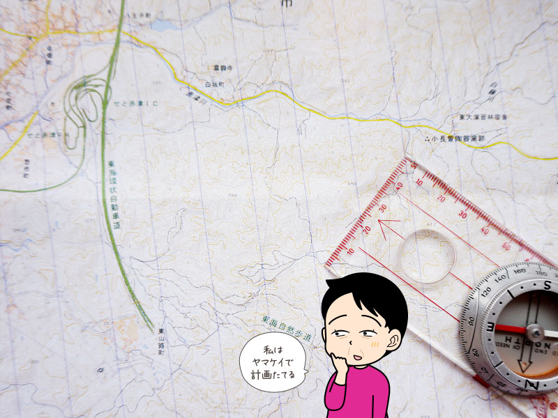 登山地図を見る登山者のイラスト