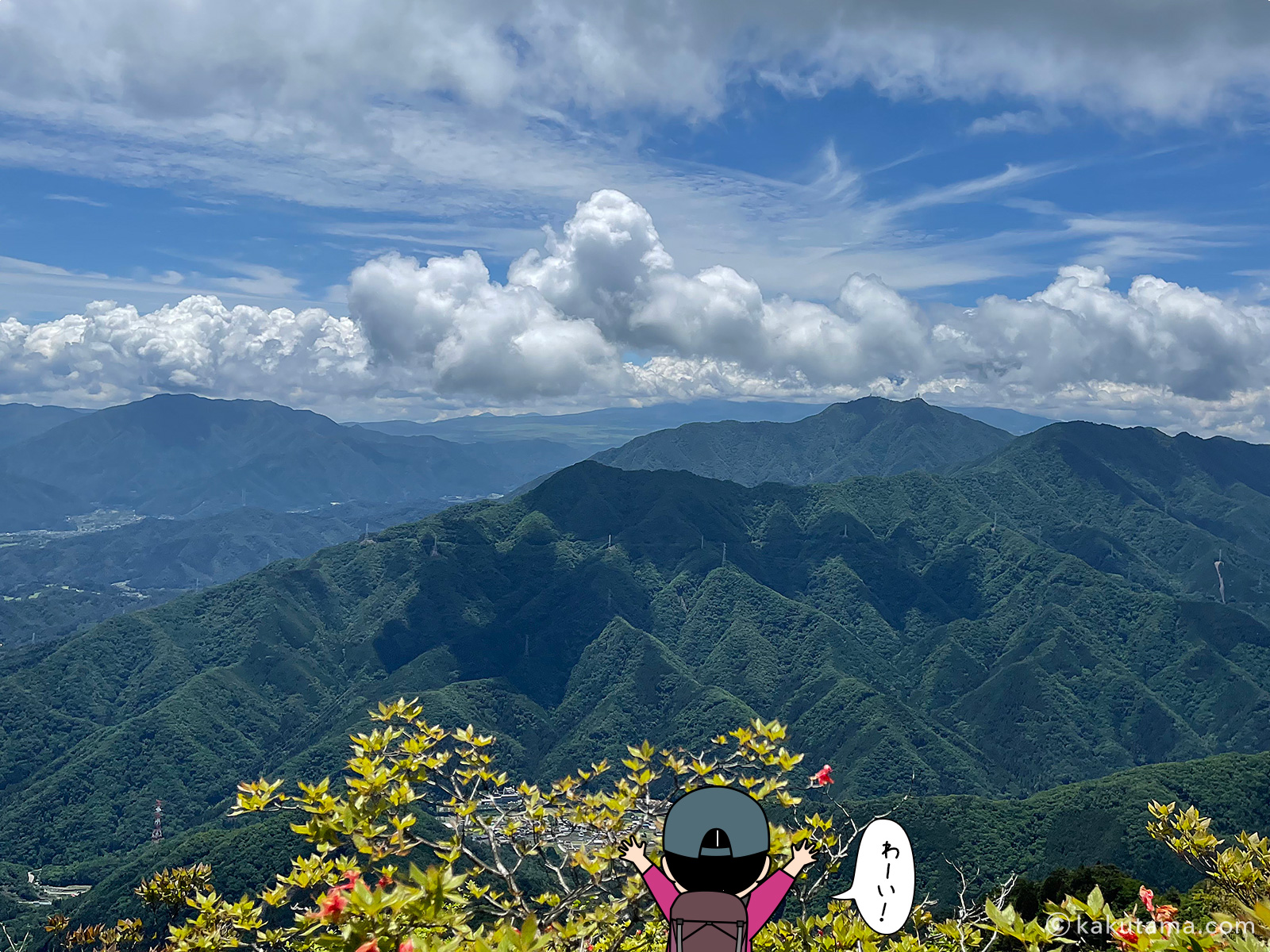 滝子山山頂から見る大月市内の写真と登山者のイラスト